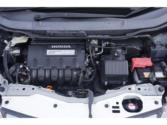 フィットハイブリッド スマートセレクション　１年保証付　純正ＨＤＤナビ　ワンセグＴＶ　バックカメラ　ＣＤ・ＤＶＤ再生　ステアリングスイッチ　ＨＩＤヘッドライト　オートライト　スマートキー　クルーズコントロール　オートエアコン　電動格納ミラー（51枚目）