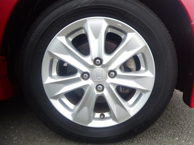 フィットハイブリッド ナビプレミアムセレクション 純正HDDナビ リアカメラ ETC HIDライト ヒートシーター スマートキー 記録簿 エアコン 運転席エアバッグ DVD再生 キーフリー ワンセグ パワーウィンドウ Bカメラ クルーズコントロール(24枚目)