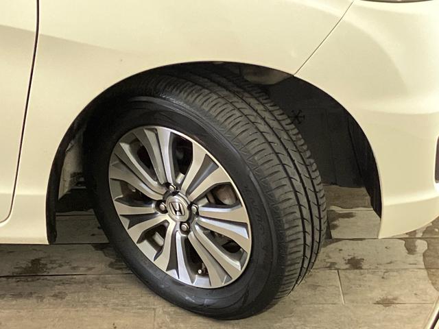 フリードスパイク GL 禁煙 ストラーダナビ 両側電動スライドドア スマートキー リアカメラ ETC クルーズコントロール 横滑り防止装置 弊社下取り車 純正アルミ 地デジ CD/DVD フルオートエアコン 記録簿付き(15枚目)