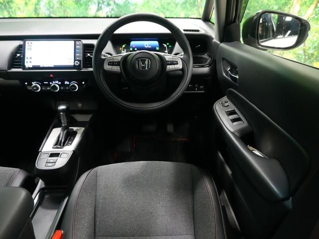 フィット e:HEVホーム 20周年特別仕様車 カーサ 無限フルエアロ 純正9型メモリナビ フルセグTV バックカメラ ハーフレザーシート ビルトインETC 純正16AW LED ソナーセンサー レーダークルーズ LKA AHB 衝突軽減 スマートキー(7枚目)