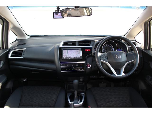 フィット １３Ｇ・Ｆパッケージ　電動格納式ドアミラー　ブルートゥース　イモビ　安全ボディ　ＤＶＤ再生可能　スマ－トキ－　記録簿有り　ＶＳＡ　ＥＴＣ付き　禁煙　助手席エアバッグ　メモリーナビ　Ｒカメラ　オートエアコン　エアバック　ＰＳ（20枚目）