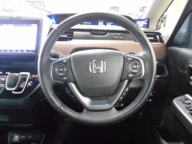 フリードハイブリッド ハイブリッド・クロスターホンダセンシング　禁煙　ワンオーナー　前後カメラ　アドバンスドルームミラ－　追突軽減ブレーキ　サイドエアバッグ　９型ナビ　シートヒーター　スマートキー　ＥＴＣ２．０　フルセグ　ＤＶＤ再生　両パワースライド　ＤＶＤ再生（29枚目）