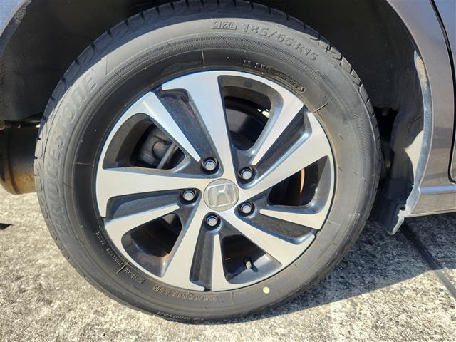 フリードハイブリッド ハイブリッド・EX 禁煙車 バックモニター アダプティブクルコン 衝突被害軽減 車線逸脱防止 誤発進抑制 LEDオートライト 純正9型ナビTV 両側パワスラ ビルトインETC 半革シート 前席シートヒーター スマートキー(18枚目)