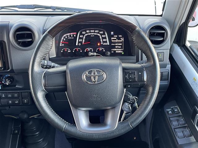 ランドクルーザー７０ ＡＸ　７インチディスプレイオーディオ　バックカメラ　純正１６型アルミホイール　純正フロアマット　センターデフロック　ダウンヒルアシストコントロール　本革ステアリング　ＬＥＤヘッドライト　寒冷地仕様　ＥＴＣ（5枚目）