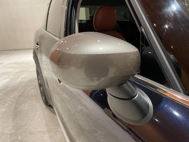 ＭＩＮＩ クーパーＤ　クロスオーバー　オール４　プレミアムプラスＰＫＧ　ＣＬＡＳＳＩＣＴＲＩＭ　シルバールーフ＆ミラーキャップ　ＡＣＣ　マルチディスプレイメーターパネル　革調シートカバー　シートヒーター　純正ＨＤＤナビ　バックカメラ　禁煙車（45枚目）