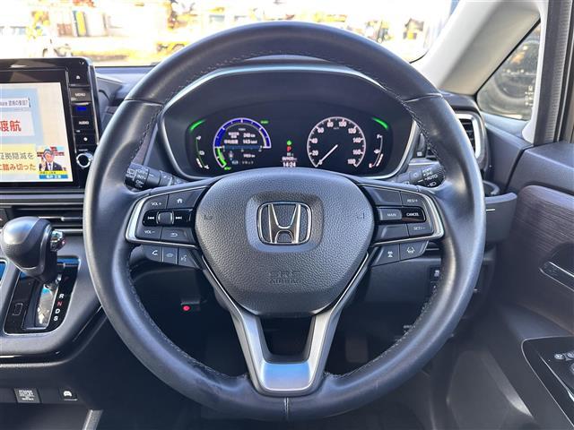 オデッセイハイブリッド ｅ：ＨＥＶアブソルート・ＥＸ　ホンダセンシング　ＢＳＭ　純正１１．６インチフリップダウンモニター　純正１０インチナビ　マルチビューカメラシステム　ＥＴＣ２．０　ドライブレコーダー　ハンズフリーパワーバックドア　両側電動スライドドア（21枚目）