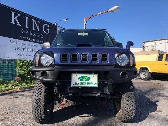 ジムニー ワイルドウインド　８０周年記念車　４ＷＤ　モーターファーム３インチリフトアップ　社外ラテラル　社外マフラ－　社外１６インチアルミ　マッドタイヤ　ロングブレーキホース　ＬＥＤヘッド　ＬＥＤテール　背面タイヤ　ＥＴＣ（6枚目）