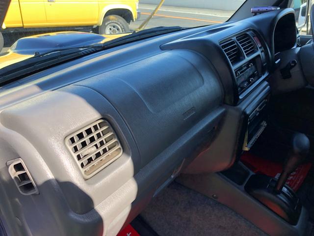 ジムニー ワイルドウインド　８０周年記念車　４ＷＤ　モーターファーム３インチリフトアップ　社外ラテラル　社外マフラ－　社外１６インチアルミ　マッドタイヤ　ロングブレーキホース　ＬＥＤヘッド　ＬＥＤテール　背面タイヤ　ＥＴＣ（32枚目）