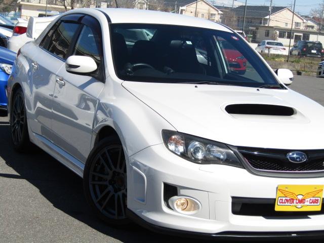 インプレッサ ＷＲＸ　ＳＴｉ　６速ＭＴ　フレキシブルタワーバー　ハーフレザー　ＳＴｉ１８ＡＷ　ＨＩＤライト　パワーシート　ブーストメーター　油温メーター　Ｓｉドライブ　４本出しマフラー　大型リアスポ　スマートキ－（33枚目）