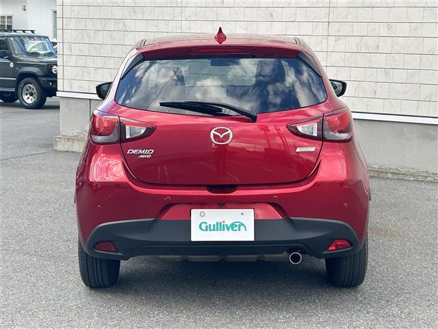 デミオ １５Ｓツーリング　４ＷＤ　純正ナビＦＭ／ＡＭ／Ｂｌｕｅｔｏｏｔｈ　スマートシティブレーキサポート　ＢＳＭシステム　車線逸脱防止装置　横滑り防止装置　バックカメラ　ＡＵＴＯライト　スペアキー　スマートキー　冬タイヤ積載（3枚目）