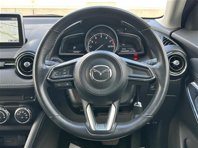 デミオ １５Ｓツーリング　４ＷＤ　純正ナビＦＭ／ＡＭ／Ｂｌｕｅｔｏｏｔｈ　スマートシティブレーキサポート　ＢＳＭシステム　車線逸脱防止装置　横滑り防止装置　バックカメラ　ＡＵＴＯライト　スペアキー　スマートキー　冬タイヤ積載（18枚目）