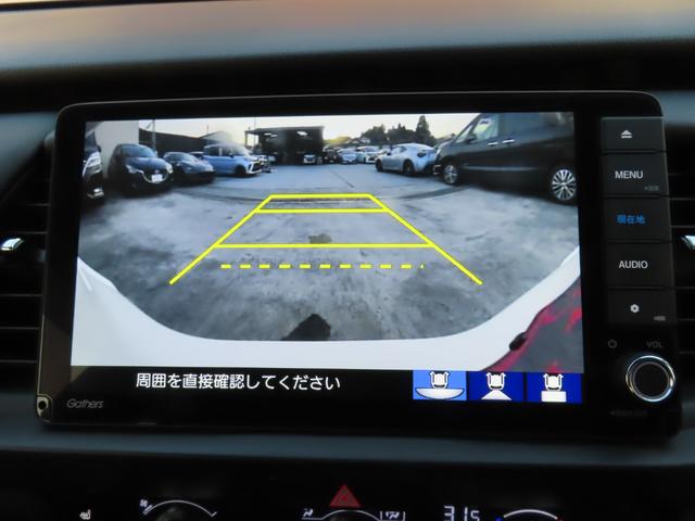 フィット ｅ：ＨＥＶリュクス　純正８インチナビ　フルセグＴＶ　バックカメラ　レーダークルーズコントロール　クリアランスソナー　衝突被害軽減ブレーキ　車線逸脱警報　ハーフレザーシート　ＬＥＤヘッドライト　社外アルミ（12枚目）