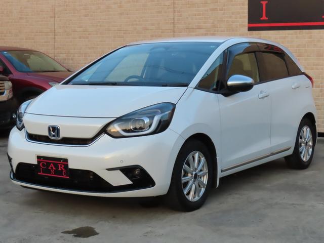 フィット ｅ：ＨＥＶリュクス　純正８インチナビ　フルセグＴＶ　バックカメラ　レーダークルーズコントロール　クリアランスソナー　衝突被害軽減ブレーキ　車線逸脱警報　ハーフレザーシート　ＬＥＤヘッドライト　社外アルミ（22枚目）