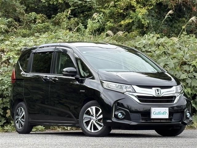 フリードハイブリッド ハイブリッド・EX レーダーC 地デジフルセグTV 車線逸脱警報装置 シ-トヒ-タ- AUX リヤカメラ LEDライト フルオートエアコン ABS DVD再生可 ウォークスルー サイドエアバッグ キーフリー ナビ&TV(2枚目)