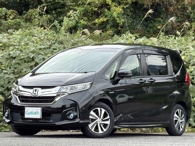 フリードハイブリッド ハイブリッド・EX レーダーC 地デジフルセグTV 車線逸脱警報装置 シ-トヒ-タ- AUX リヤカメラ LEDライト フルオートエアコン ABS DVD再生可 ウォークスルー サイドエアバッグ キーフリー ナビ&TV(4枚目)