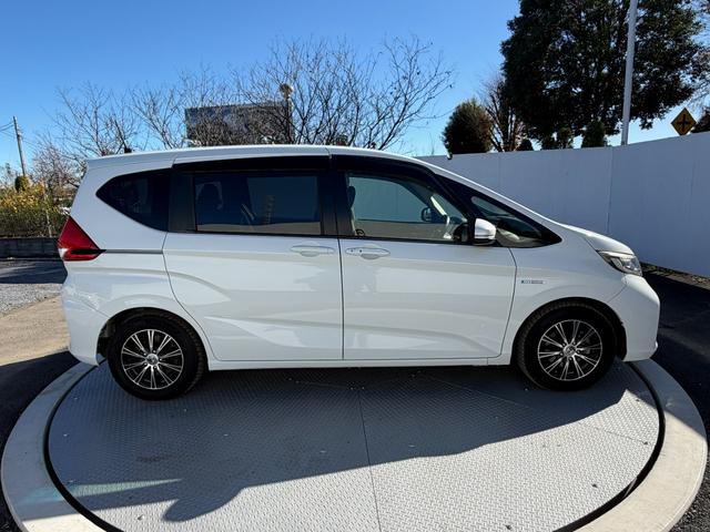 フリードハイブリッド ハイブリッド・Gホンダセンシング ワンオーナー・ドラレコ・9インチ・純ナビTV・Bluetooth・インターナビ・ルーフモニター・両パワスラ・スマートキー・LED 軽減ブレーキ キーフリーシステム 1オ-ナ- 記録簿 DVD再生可能(26枚目)