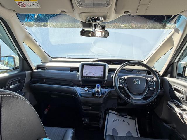 フリードハイブリッド ハイブリッド・Gホンダセンシング ワンオーナー・ドラレコ・9インチ・純ナビTV・Bluetooth・インターナビ・ルーフモニター・両パワスラ・スマートキー・LED 軽減ブレーキ キーフリーシステム 1オ-ナ- 記録簿 DVD再生可能(33枚目)