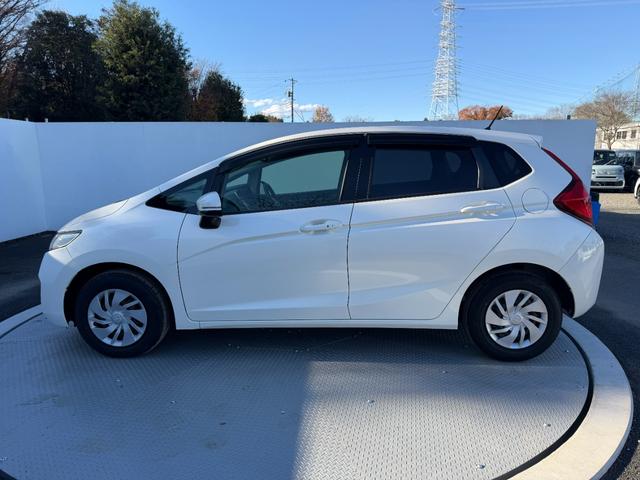 フィット 13G・Fパッケージ ワンオーナー・7インチ純ナビTV・スマートキー・ETC ワンオーナー車 DVD再生可能 スマ-トキ- 記録簿有り VSA ETC付き 助手席エアバッグ オートエアコン エアバック PS キ-フリ-(26枚目)