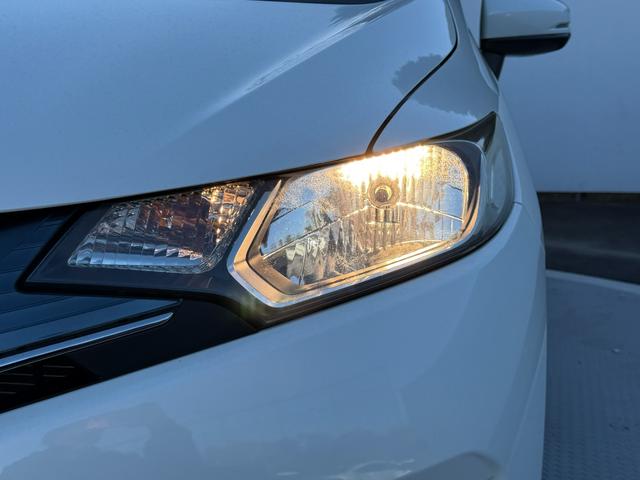 フィット 13G・Fパッケージ ワンオーナー・7インチ純ナビTV・スマートキー・ETC ワンオーナー車 DVD再生可能 スマ-トキ- 記録簿有り VSA ETC付き 助手席エアバッグ オートエアコン エアバック PS キ-フリ-(27枚目)