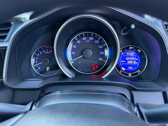 フィット 13G・Fパッケージ ワンオーナー・7インチ純ナビTV・スマートキー・ETC ワンオーナー車 DVD再生可能 スマ-トキ- 記録簿有り VSA ETC付き 助手席エアバッグ オートエアコン エアバック PS キ-フリ-(32枚目)