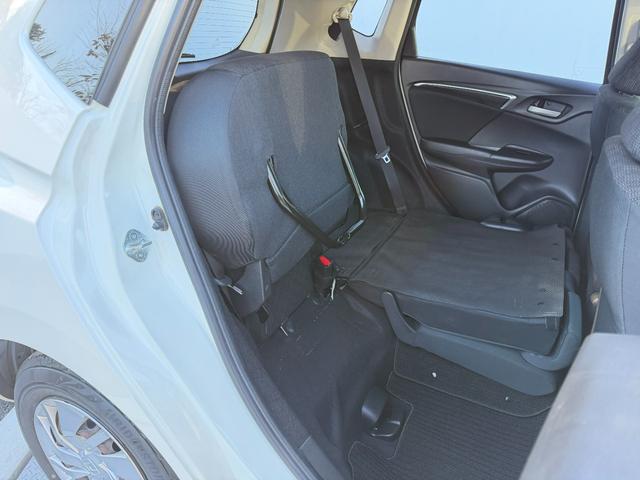 フィット 13G・Fパッケージ ワンオーナー・7インチ純ナビTV・スマートキー・ETC ワンオーナー車 DVD再生可能 スマ-トキ- 記録簿有り VSA ETC付き 助手席エアバッグ オートエアコン エアバック PS キ-フリ-(45枚目)