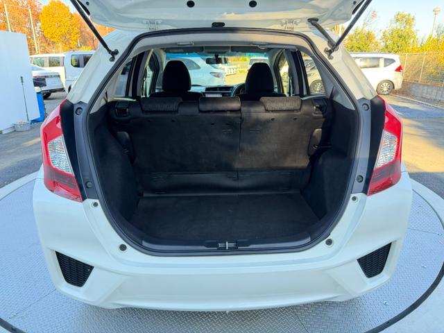 フィット 13G・Fパッケージ ワンオーナー・7インチ純ナビTV・スマートキー・ETC ワンオーナー車 DVD再生可能 スマ-トキ- 記録簿有り VSA ETC付き 助手席エアバッグ オートエアコン エアバック PS キ-フリ-(48枚目)