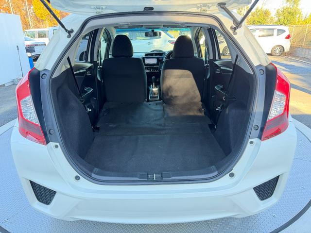 フィット 13G・Fパッケージ ワンオーナー・7インチ純ナビTV・スマートキー・ETC ワンオーナー車 DVD再生可能 スマ-トキ- 記録簿有り VSA ETC付き 助手席エアバッグ オートエアコン エアバック PS キ-フリ-(49枚目)