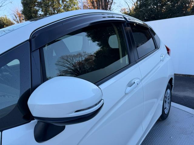 フィット 13G・Fパッケージ ワンオーナー・7インチ純ナビTV・スマートキー・ETC ワンオーナー車 DVD再生可能 スマ-トキ- 記録簿有り VSA ETC付き 助手席エアバッグ オートエアコン エアバック PS キ-フリ-(58枚目)