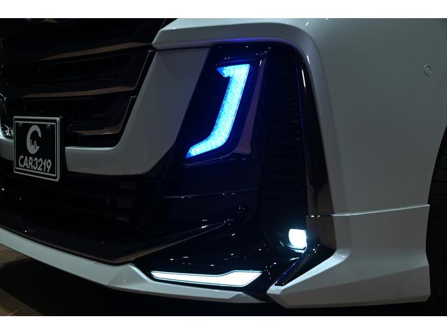 ヴェルファイアハイブリッド Ｚ　プレミア　黒革／モデリスタエアロ（Ｆ・Ｓ・Ｒ）／モデリスタマフラー／シグネチャーイルミブレード／イルミルーフスポイラー／サイドエンブレムイルミ／ピラーライト／ディスプレイオーディオ／リアモニター／ＥＴＣ／全方位（50枚目）