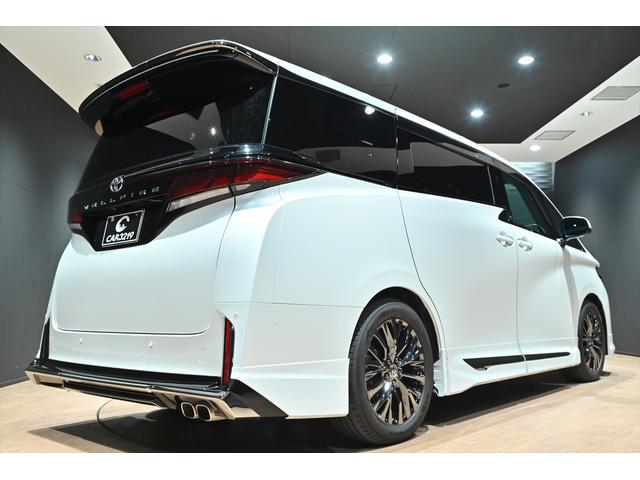 ヴェルファイアハイブリッド Ｚ　プレミア　黒革／モデリスタエアロ（Ｆ・Ｓ・Ｒ）／モデリスタマフラー／シグネチャーイルミブレード／イルミルーフスポイラー／サイドエンブレムイルミ／ピラーライト／ディスプレイオーディオ／リアモニター／ＥＴＣ／全方位（54枚目）