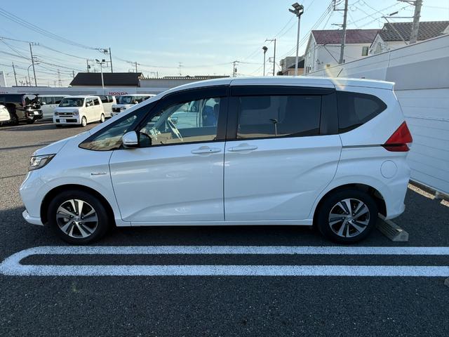 フリードハイブリッド ハイブリッド・Gホンダセンシング 軽減ブレーキ キーフリーシステム 記録簿 DVD再生可能 後カメラ Aクルーズ 地デジフルセグTV LEDヘッドランプ 横滑防止 パワーウインドウ 3列シート USB(21枚目)