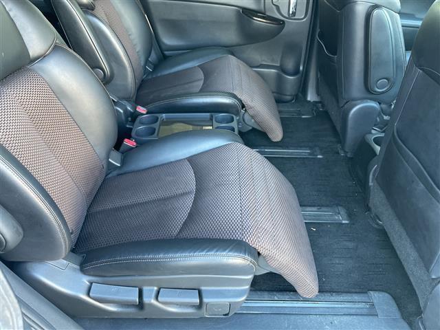 エルグランド 250ハイウェイスター 社外ナビ 社外フリップダウンモニター 両側パワスラ 半革シート 革巻きステアリング オートライト ウィンカーミラー 木目調パネル ETC 純正18インチAW スマートキー スペアキー 保証書 取説(23枚目)