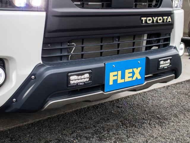 ハイエースバン スーパーGL ダークプライムII ロングボディ 二段ベッド パナソニックナビ パイオニアフリップダウンモニター 社外デジタルインナーミラー TRD オフロードバンパー マッドフラップ ETC アルミホイール 強化スタビライザー サテライトスピーカー(27枚目)