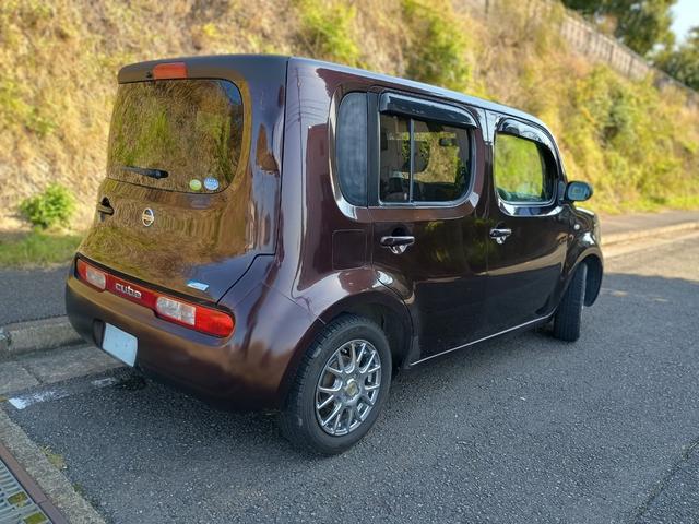 キューブ 15X Mセレクション 社外アルミ(スタッドレス履き)社外ナビ ドアバイザー 記録簿 スマートキー ETC 肘掛け バックカメラ ワンセグtv 無煙草臭 無事故(4枚目)