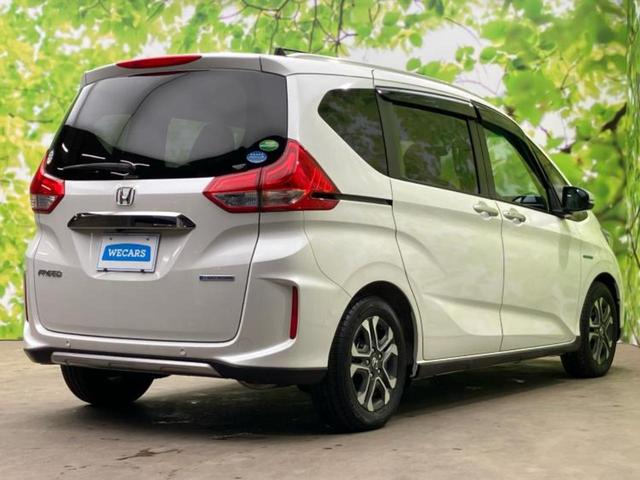 フリードハイブリッド ハイブリッドクロスターホンダセンシング 新品タイヤ/保証書/純正 9インチ SDナビ/ホンダセンシング/両側電動スライドドア/シートヒーター 前席/車線逸脱防止支援システム/シート ハーフレザー/ドライブレコーダー 前後 バックカメラ(3枚目)