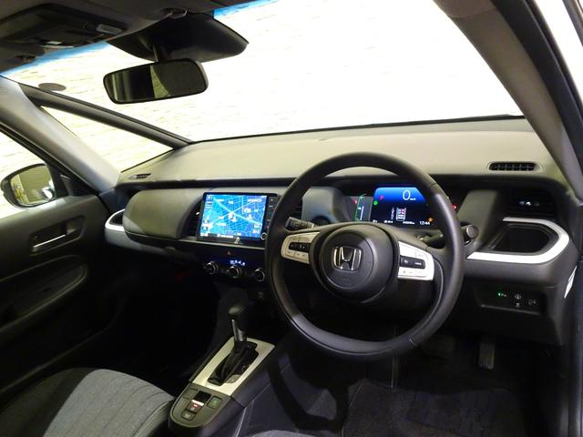 フィット ｅ：ＨＥＶホーム　禁煙　純正９ｉｎｃｈナビＴＶ　ＥＴＣ　ＬＥＤ　リアカメラ　Ｂｌｕｅｔｏｏｔｈ　衝突軽減Ｂ　ＶＳＡ　サイドエアバック　パーキングセンサー　クルーズコントロール　スマートキー　オートＡＣ　ワンオーナー（13枚目）