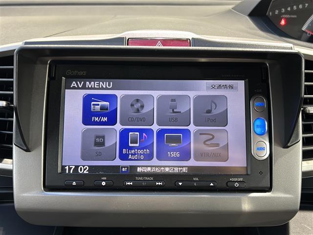 フリード G ジャストセレクション 純正メモリナビ・DVD・CD・AM・FM・Bluetooth・ワンセグTV・バックカメラ・ステアリングリモコン・ドライブレコーダー前・横滑り防止・社外フロアマット・純正ホイールキャップ・両側パワスラ(3枚目)