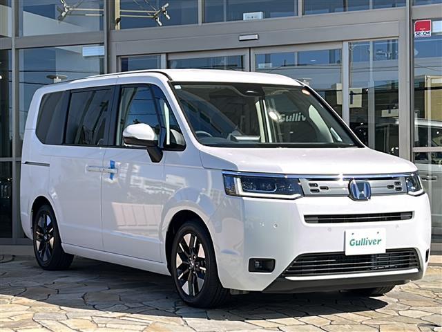 ステップワゴン e:HEVエアー EX 純正ナビ バックカメラ 2列目オットマン 後席フリップダウンモニター クリアランスソナー ブラインドスポット パワーテールゲート 後席エアコン シートヒーター 全列USB 純正16インチアルミ(32枚目)