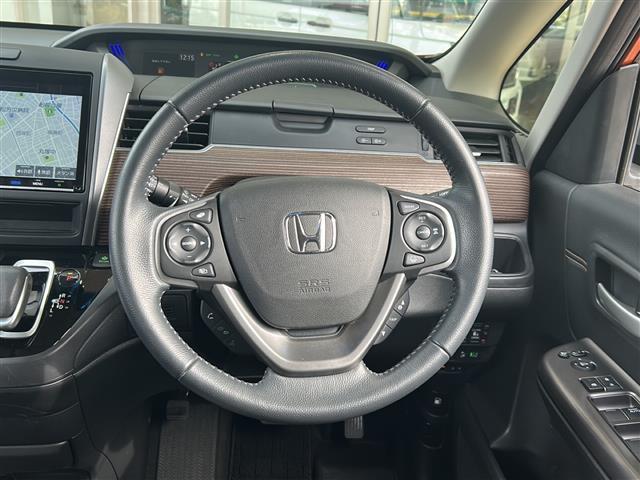 フリードハイブリッド ハイブリッド・クロスターホンダセンシング 純正ナビ ドライブレコーダー シートヒーター レーダークルーズコントロール スマートキー 両側パワースライドドア ETC バックカメラ ステアリングリモコン レーンキープ プッシュスタート 純正アルミ(7枚目)