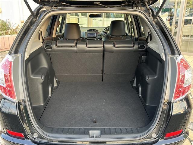 フィットシャトルハイブリッド ハイブリッド・スマートセレクション　純正ナビ　バックカメラ　ビルトインＥＴＣ　１５インチ純正アルミ　横滑り防止装置　ヒルスタートアシスト　オートエアコン　フォグランプ　オートライト　パドルシフト　ステアリングリモコン　ＨＩＤライト（27枚目）