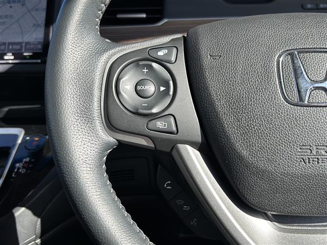 フリード+ハイブリッド ハイブリッド・クロスターホンダセンシング 純正ナビ バックカメラ フリップダウンモニター ホンダセンシング ハーフレザーシート シートヒーター LEDヘッドライト ETC サイドカーテンエアバッグ ルーフレール オートライト 純正アルミ(7枚目)