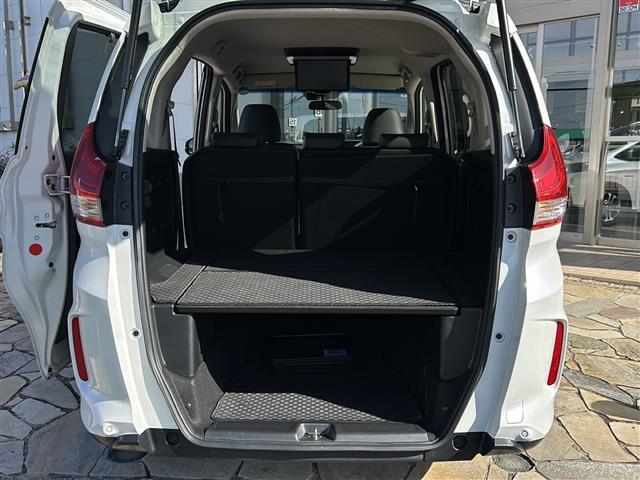 フリード+ハイブリッド ハイブリッド・クロスターホンダセンシング 純正ナビ バックカメラ フリップダウンモニター ホンダセンシング ハーフレザーシート シートヒーター LEDヘッドライト ETC サイドカーテンエアバッグ ルーフレール オートライト 純正アルミ(28枚目)