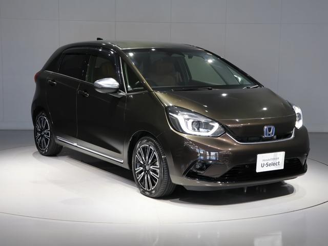 フィット e:HEVリュクス 禁煙車 運転支援機能 衝突軽減ブレーキ LEDヘッドライト 前後ドライブレコーダ先進ライト 障害物センサー 純正9インチナビ バックカメラ Bluetooth接続 ミュージックラック ETC DVD(10枚目)