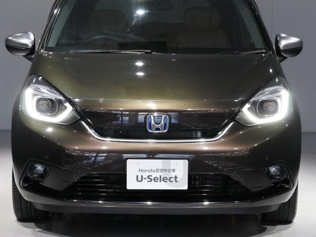 フィット e:HEVリュクス 禁煙車 運転支援機能 衝突軽減ブレーキ LEDヘッドライト 前後ドライブレコーダ先進ライト 障害物センサー 純正9インチナビ バックカメラ Bluetooth接続 ミュージックラック ETC DVD(16枚目)