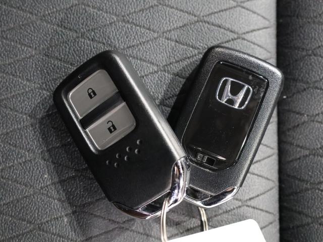 フィット e:HEVリュクス 禁煙車 運転支援機能 衝突軽減ブレーキ LEDヘッドライト 前後ドライブレコーダ先進ライト 障害物センサー 純正9インチナビ バックカメラ Bluetooth接続 ミュージックラック ETC DVD(20枚目)