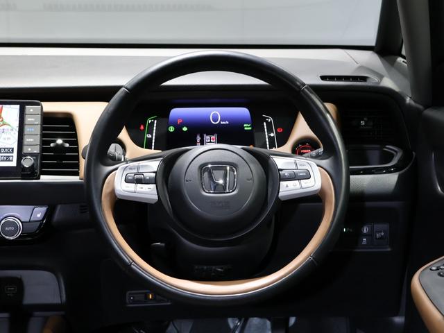 フィット e:HEVリュクス 禁煙車 運転支援機能 衝突軽減ブレーキ LEDヘッドライト 前後ドライブレコーダ先進ライト 障害物センサー 純正9インチナビ バックカメラ Bluetooth接続 ミュージックラック ETC DVD(30枚目)