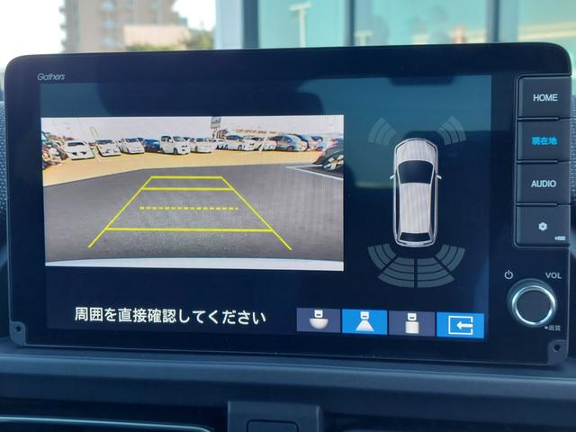 フリード e:HEVエアー EX 登録済未使用車 純正9型ナビ 後方カメラ アダクティブクルーズコントロール 両側電動スライドドア ハーフレザーシート シートヒーター リアクーラー LEDヘッドライト スマートキー 純正アルミホイール(4枚目)