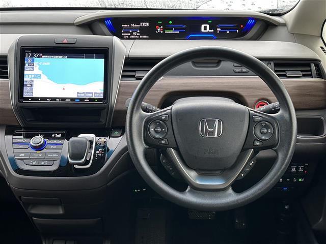 フリードハイブリッド ハイブリッド・Ｇ　ホンダセンシング　純正９インチナビ　ＤＶＤ／ＤＴＶ／Ｂｌｕｅｔｏｏｔｈ／ＵＳＢ　レーダークルーズコントロール　両側パワースライドドア　ＬＥＤオートライト　シートヒーター　ビルトインＥＴＣ（5枚目）