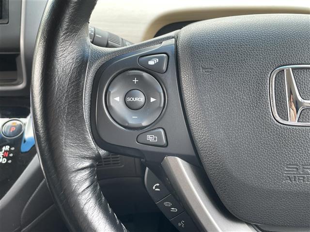 フリードハイブリッド ハイブリッド・Ｇホンダセンシング　社外ナビ　ＤＶＤ／ＤＴＶ／Ｂｌｕｅｔｏｏｔｈ　バックカメラ　レーダークルーズコントロール　両側パワースライドドア　ステアリングスイッチ　ＬＥＤオートライト　ビルトインＥＴＣ　レーンキープ　スマートキー（14枚目）