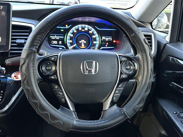 オデッセイハイブリッド ハイブリッドアブソルート・EXホンダセンシング ディスプレイオーディオ/フリップダウンモニター/両側パワースライドドア/マルチビューカメラ/ブラインドスポットモニター/パワーシート/シートヒーター/オットマン/ホンダセンシング/ビルトインETC(4枚目)